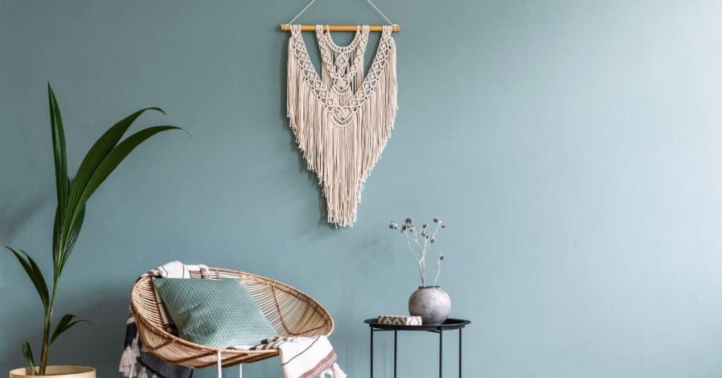 use macrame woven art to decorate your living room wall to take it from boring to fun