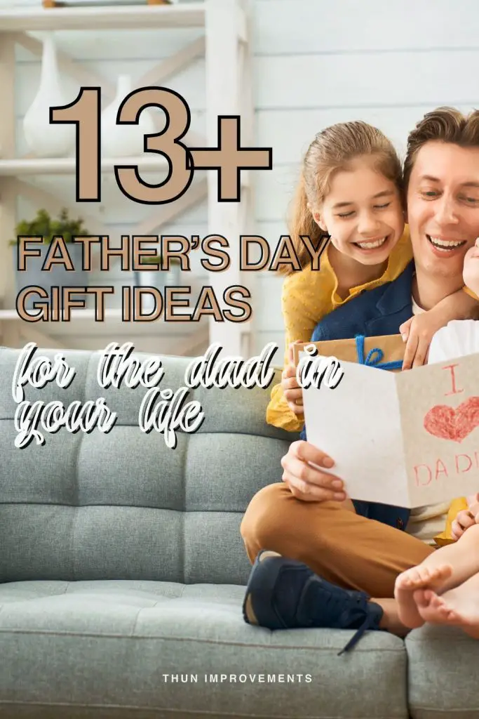 13+ fathers day gift ideas for the dad in you life - image shows a father sitting on a couch with two young children around him, reading a homemade fathers day card on the front of the card it says I heart dad